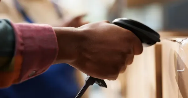 Shop owner scanning products into TillPal POS